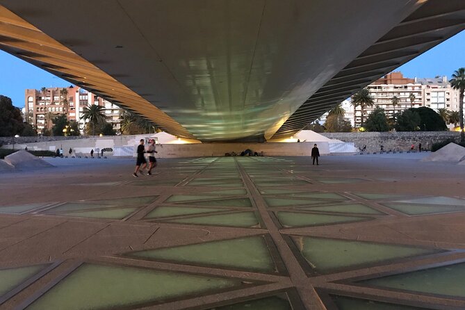 Grand City | Small Group Bike Tour through Top Highlights - Passing through the Serranos Towers