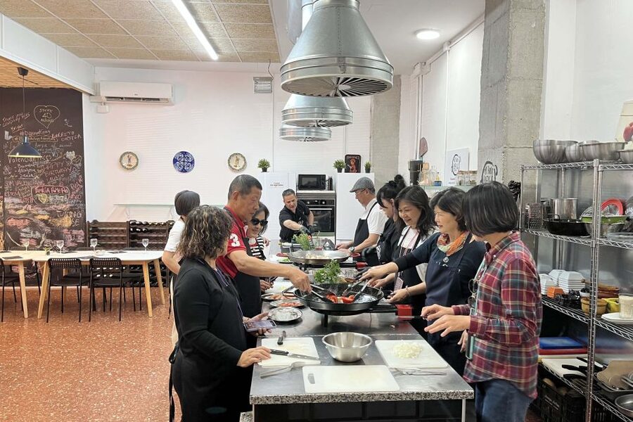 Real Paella Cooking Class – Market Visit & Sangría Workshop - Sitting down to eat what you made
