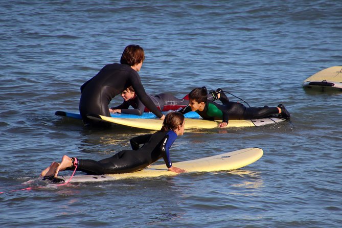 Surf lesson on Valencia beach - Sunset colors and Valencia from the water