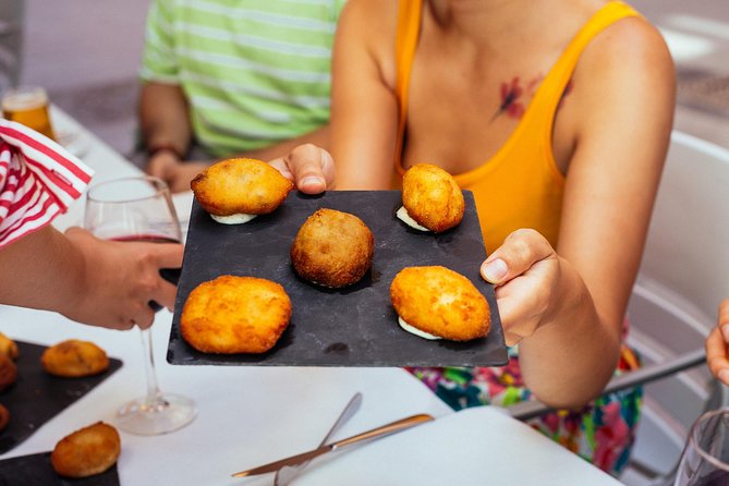 The 10 Tastings of Valencia With Locals: Private Food Walking Tour - La Lonja and the taste of medieval Valencia