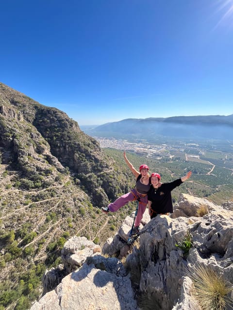 Valencia: Guided Via Ferrata Experience - Climbing boulders and steep cliff sections