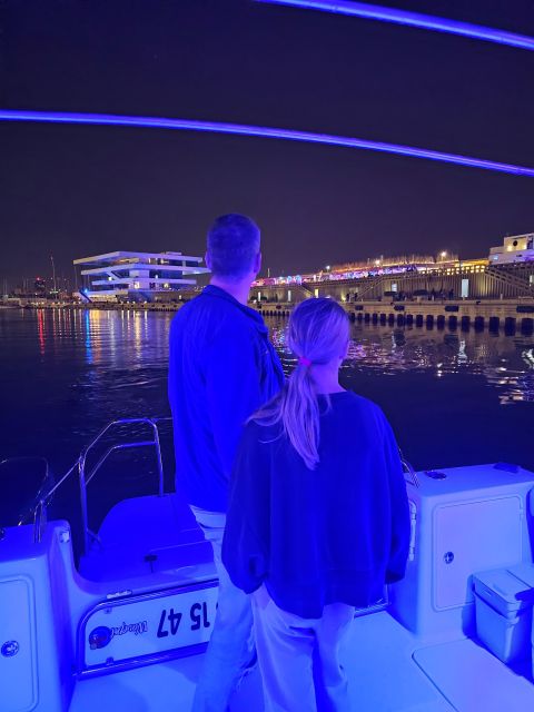 Valencia: Night Cruise with Free Drink - The lights of Veles e Vents and the port buildings