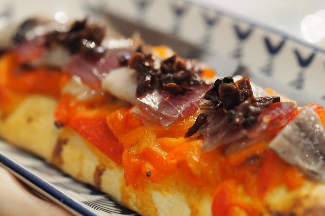 Valencia Tapas Crawl by Food Lover Tour - Stop two: familiar Spanish plates with a local rhythm