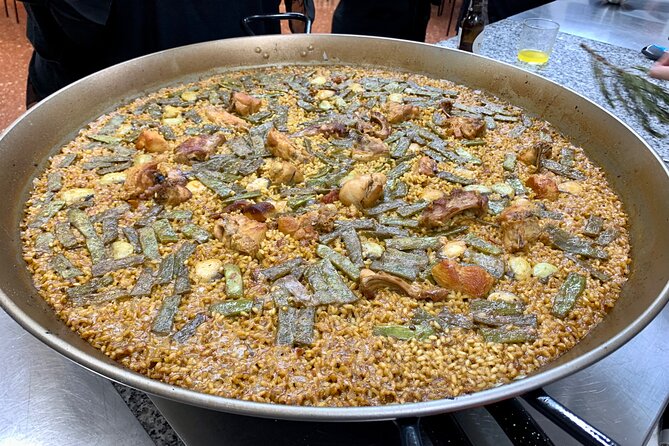 Valencian paella cooking class, tapas and visit to Ruzafa market. - Starting at San Valero Parish and Ruzafa Market